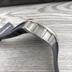 Sport watch showing silver-toned buckle and black rubber strap connection