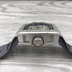 Top view of skeleton sport watch with silver case bezel and black rubber strap