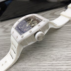 Richard Mille watch, side view of white case with crown and blue-black dial