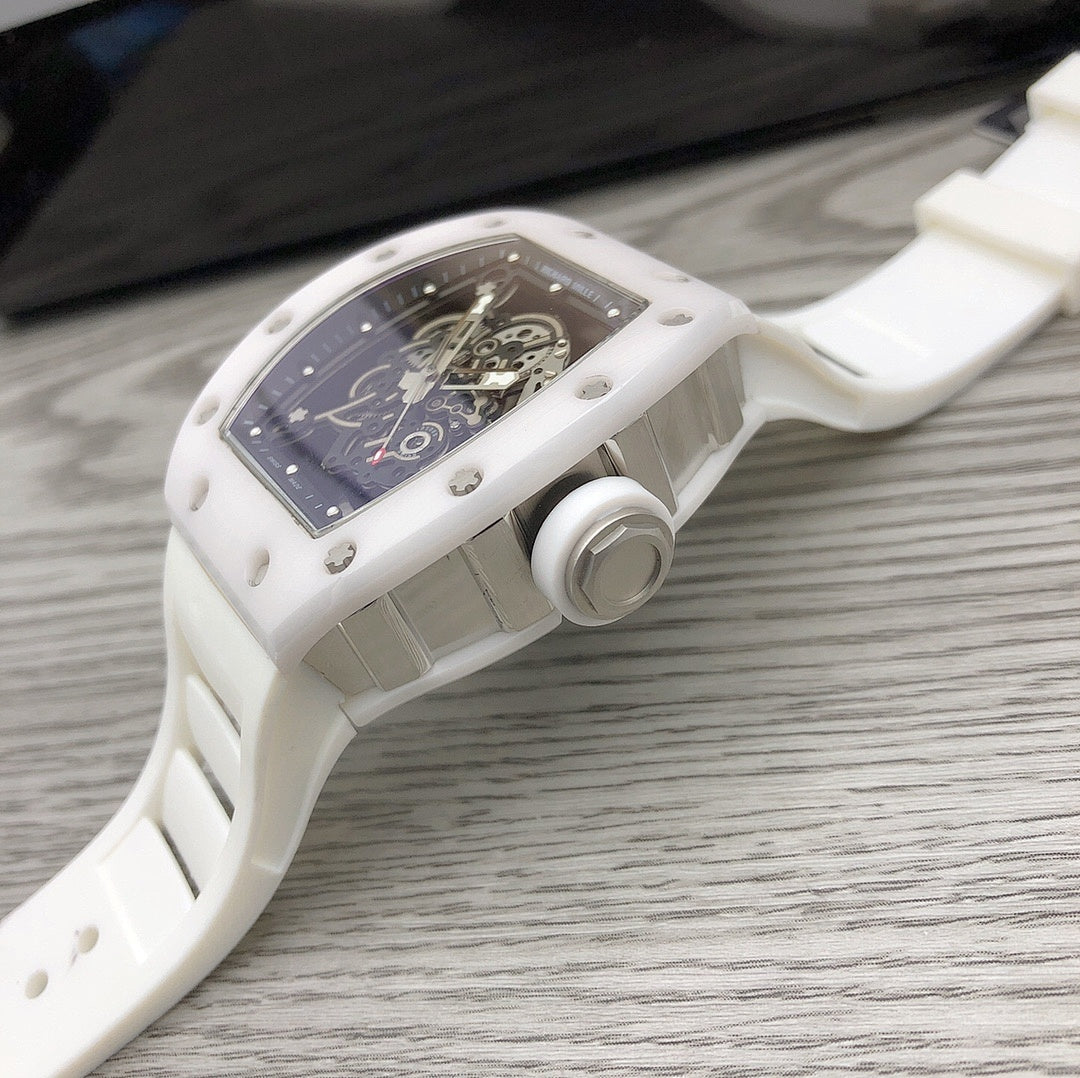 Richard Mille watch, side view of white case with crown and blue-black dial