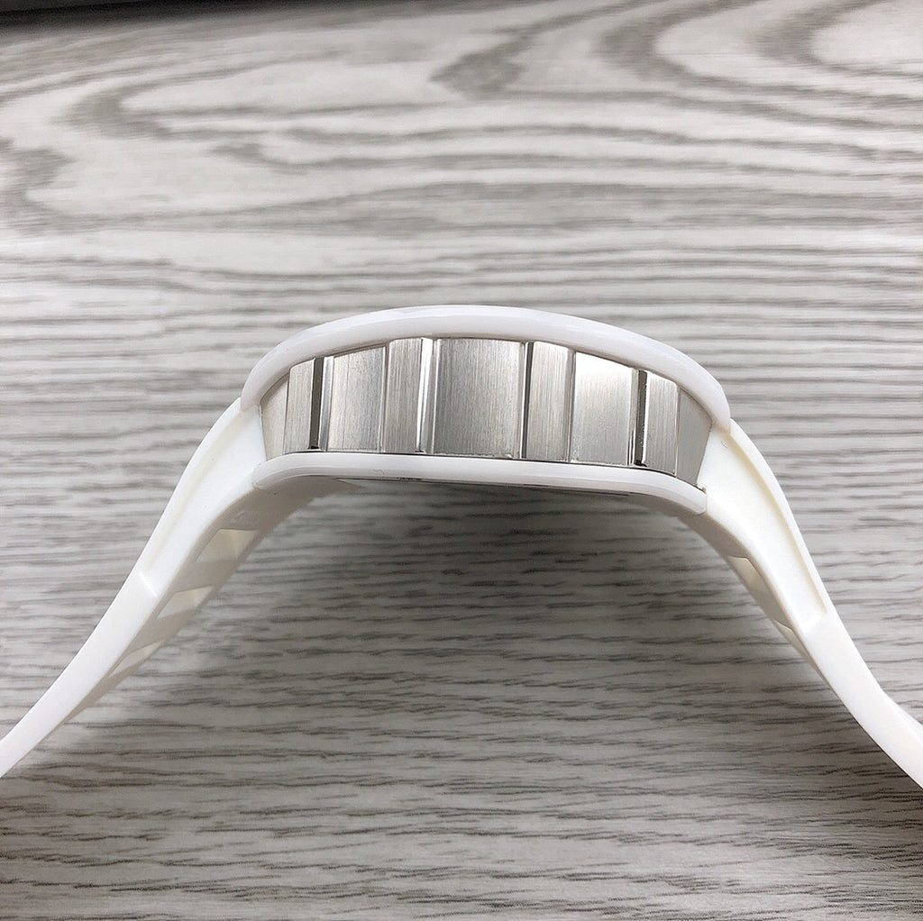 Richard Mille watch top view, stainless bezel and white strap