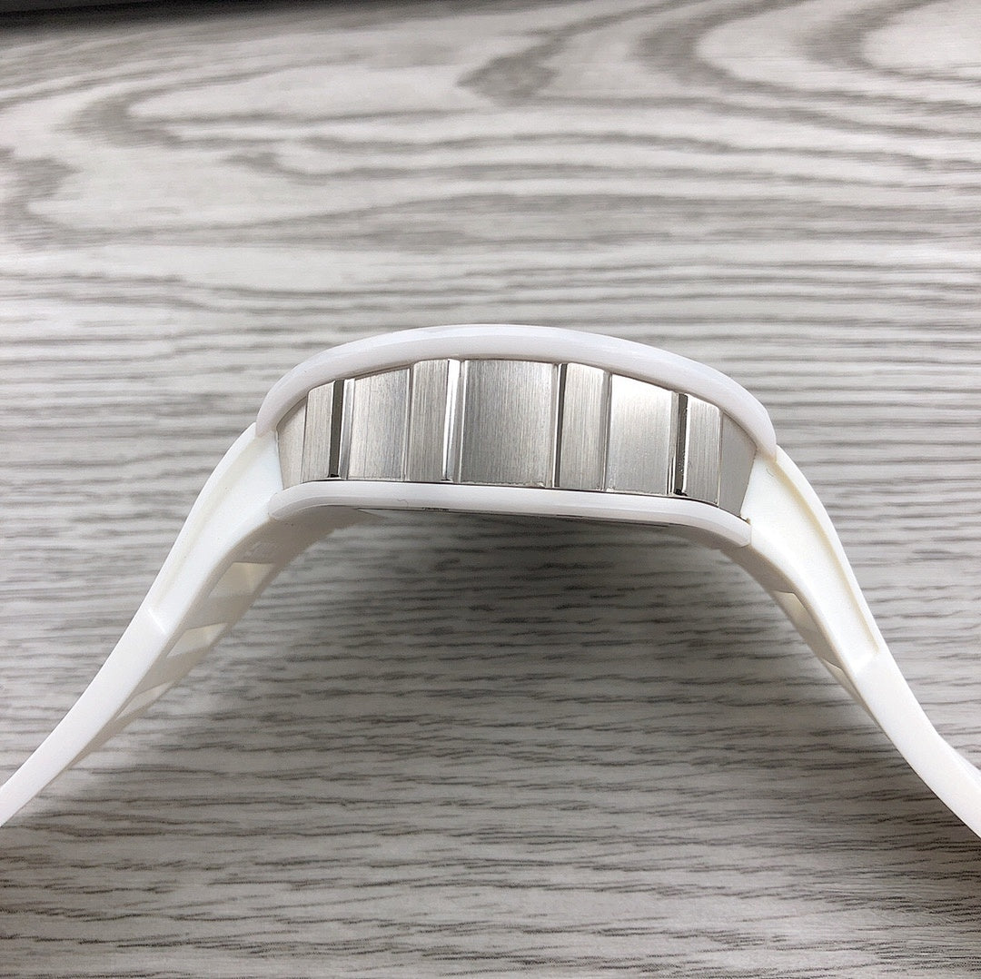 Richard Mille watch top view, stainless bezel and white strap