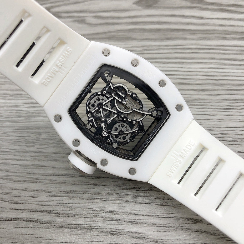 Richard Mille watch side view, white case with engraved markings and skeleton movement