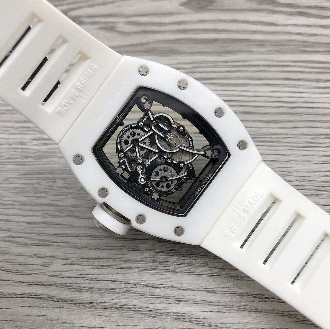 Richard Mille watch side view, white case with engraved markings and skeleton movement