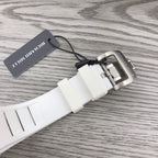 Richard Mille watch clasp on white strap with metal buckle and hang tag