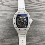 Richard Mille watch front view, white strap and square case with blue-black skeleton dial