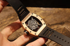 Richard Mille watch with black rubber strap, side view with crown and case detail