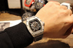Richard Mille wristwatch with skeleton dial and black rubber strap on wrist