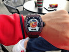 Richard Mille watch with burgundy case and black rubber strap, skeleton-style dial