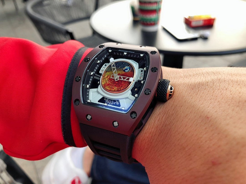 Richard Mille wristwatch, burgundy case with black strap and detailed openwork dial
