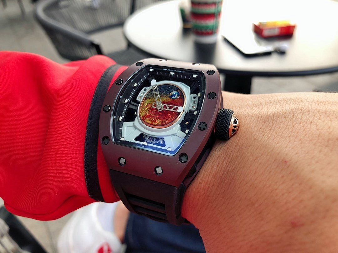 Richard Mille wristwatch, burgundy case with black strap and detailed openwork dial