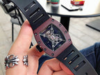 Richard Mille watch side view, burgundy case with dark openwork dial, rubber strap