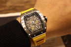 Richard Mille wristwatch with yellow rubber strap, black dial with visible skeleton movement