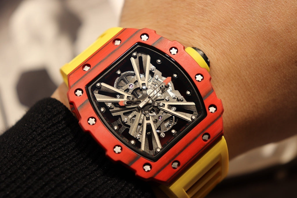 Red skeleton tourbillon watch with black dial and yellow rubber strap