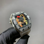 Silver-toned wristwatch with jeweled bezel, colorful skeleton dial, and light gray strap
