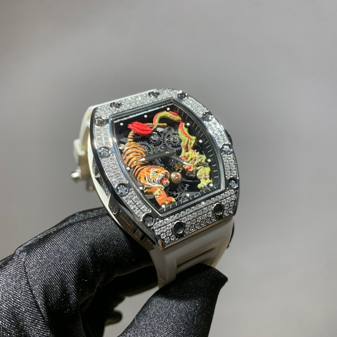 Silver-toned wristwatch with jeweled bezel, colorful skeleton dial, and light gray strap