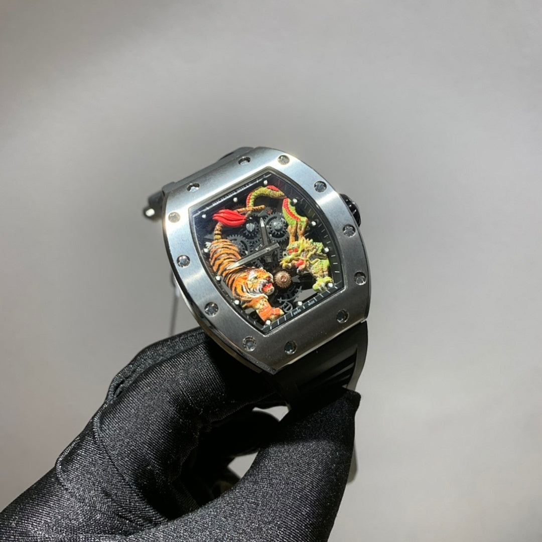 Richard Mille watch with silver-toned case, black strap, and colorful skeleton dial with dragon motif