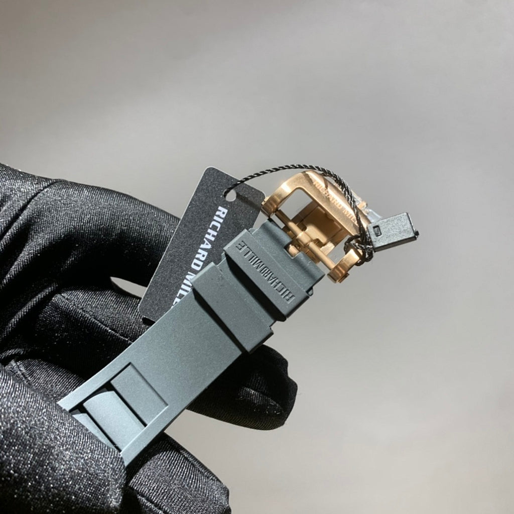 Richard Mille watch side view with light gray strap and clasp hardware