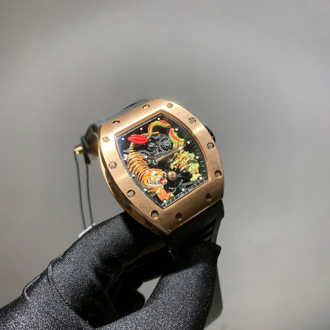 Richard Mille watch with gold-toned case, black strap, and colorful skeleton dial with dragon motif
