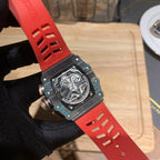 Richard Mille watch front with red strap and black dial, metal-capped case sides.