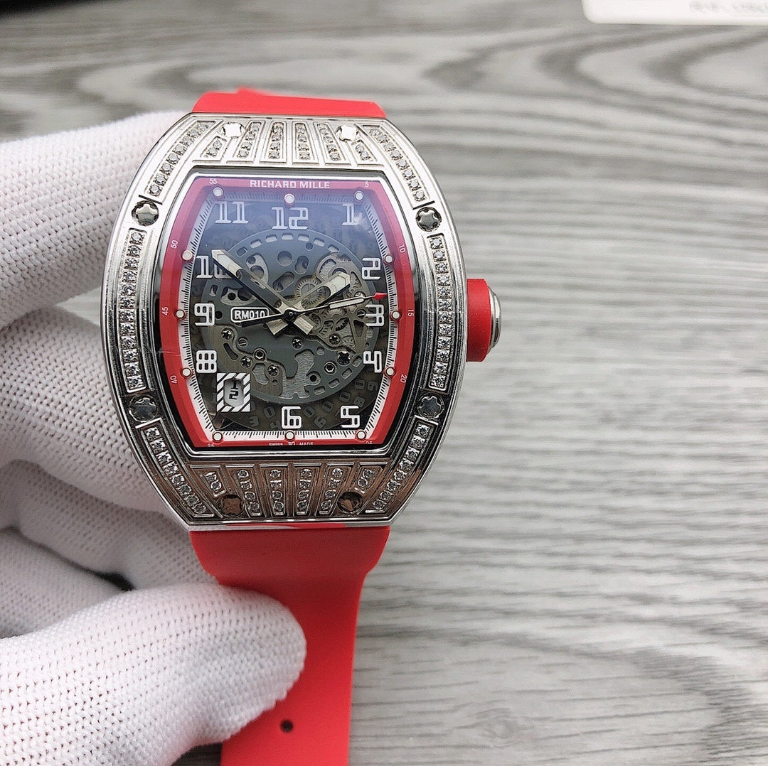 Rose-gold tonneau watch with diamond bezel and red strap
