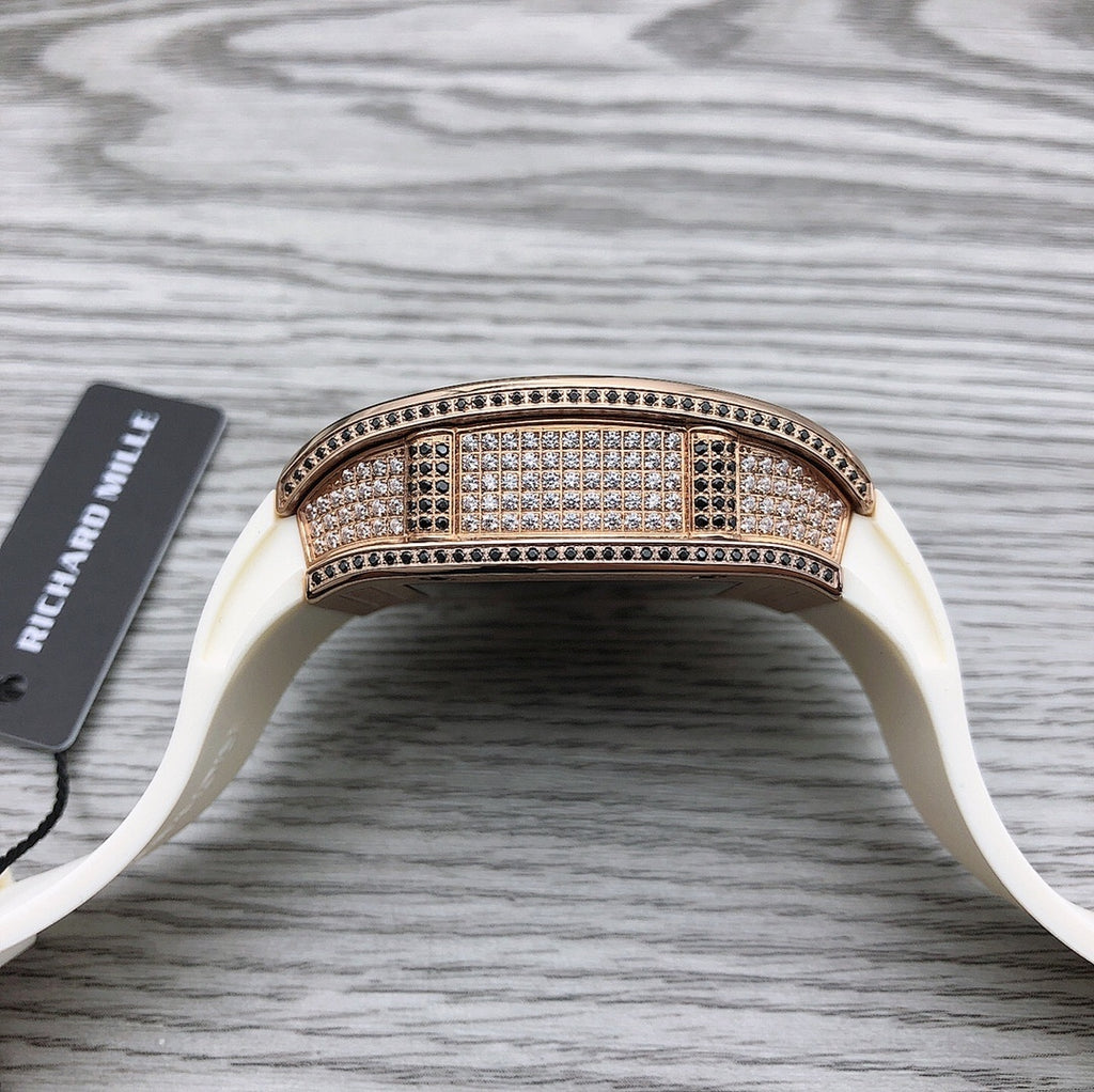 Rose-gold diamond bezel tonneau watch on white strap