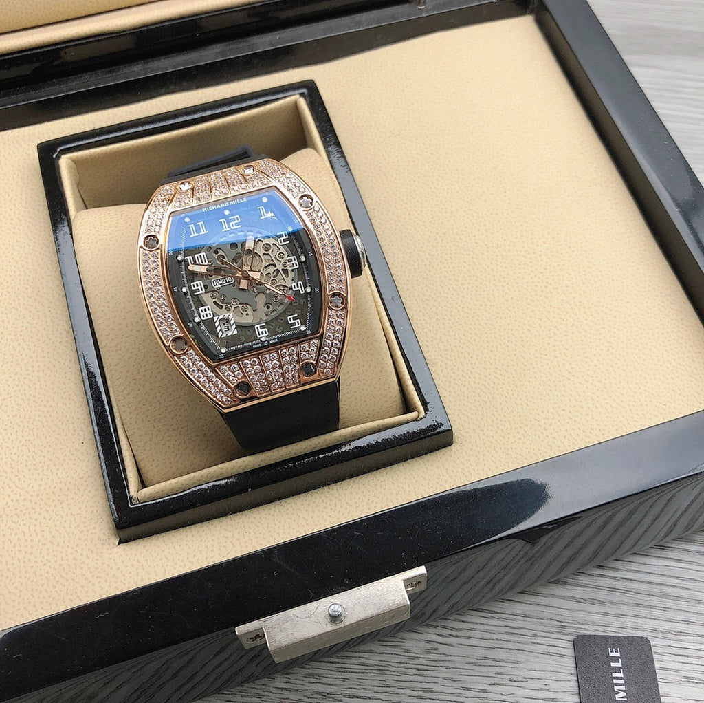 Tonneau watch with diamond bezel in beige watch box on display tray