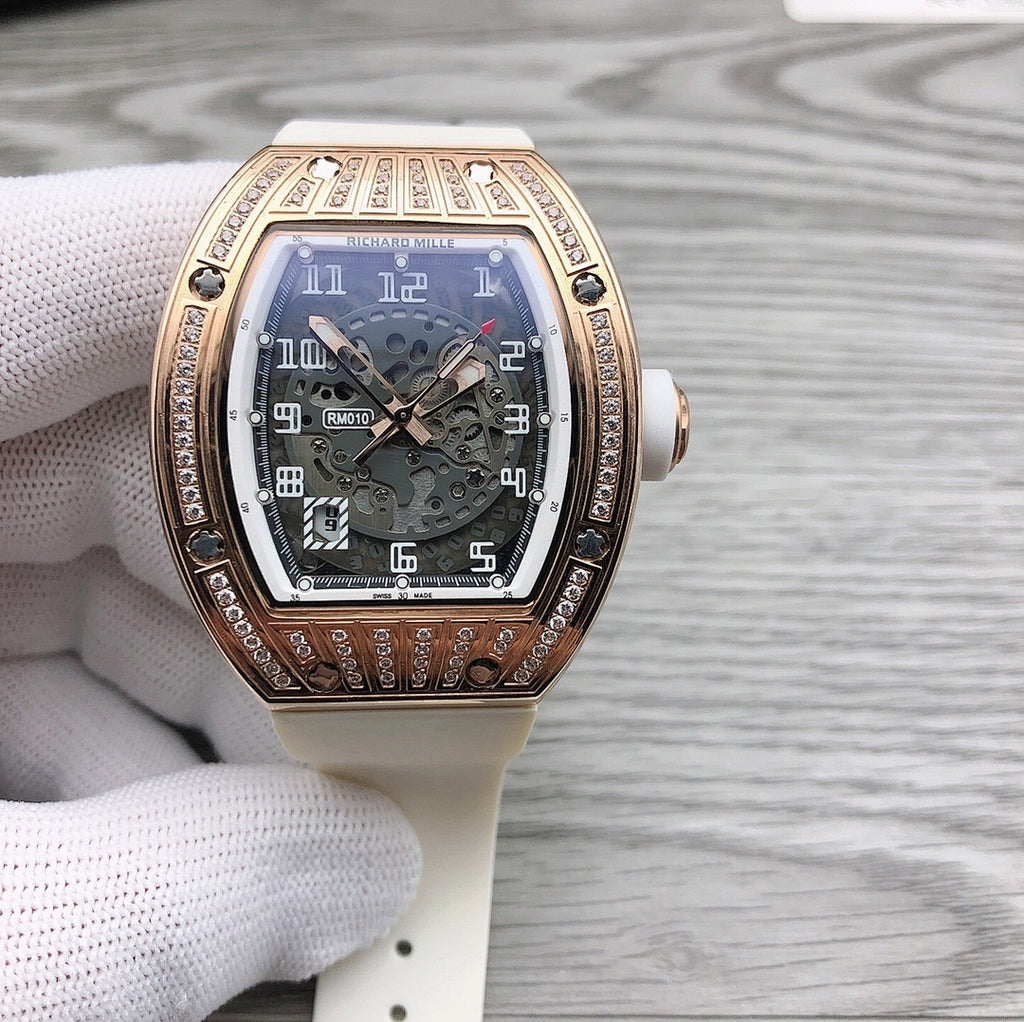 Rose-gold tonneau watch with diamond bezel and white rubber strap