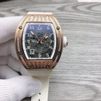 Rose-gold tonneau watch with diamond bezel and white rubber strap