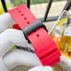 Richard Mille watch strap with red band, black clasp, and pin holes.