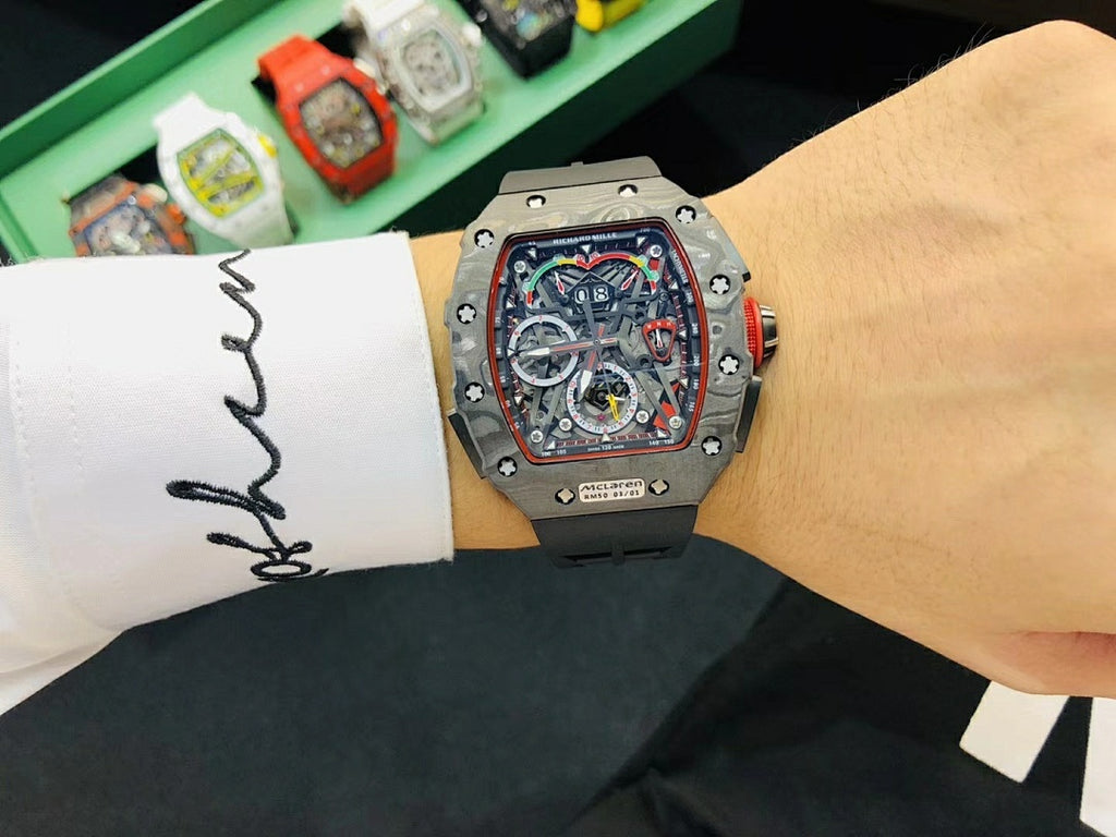 Richard Mille watch on wrist showing colorful skeleton dial and silver case
