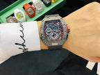 Richard Mille watch on wrist showing colorful skeleton dial and silver case