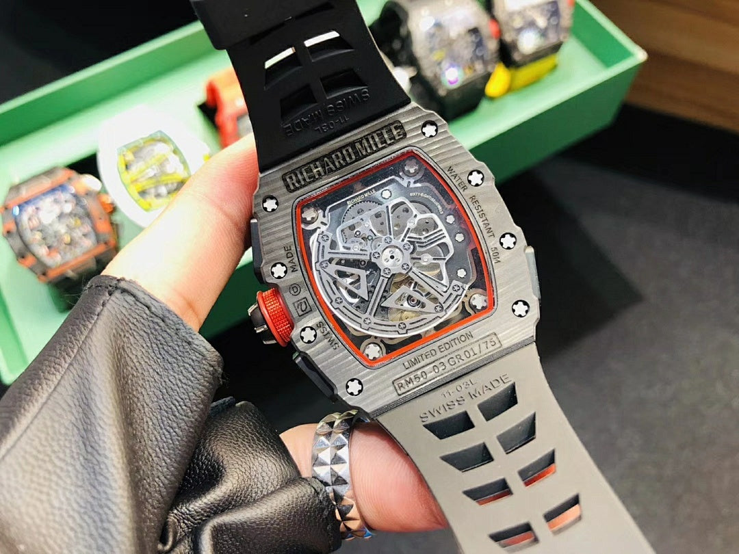 Richard Mille watch back with visible movement, black strap, and engraved details