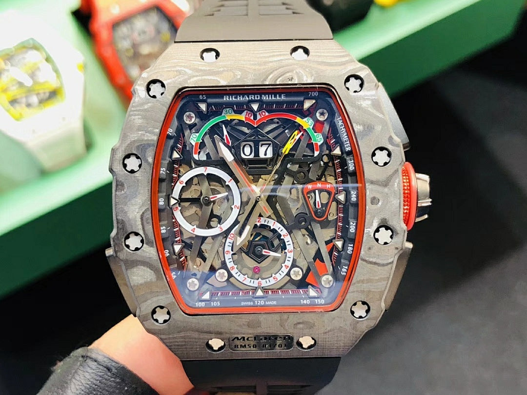 Richard Mille watch with silver-toned case, colorful skeleton dial, and black rubber strap