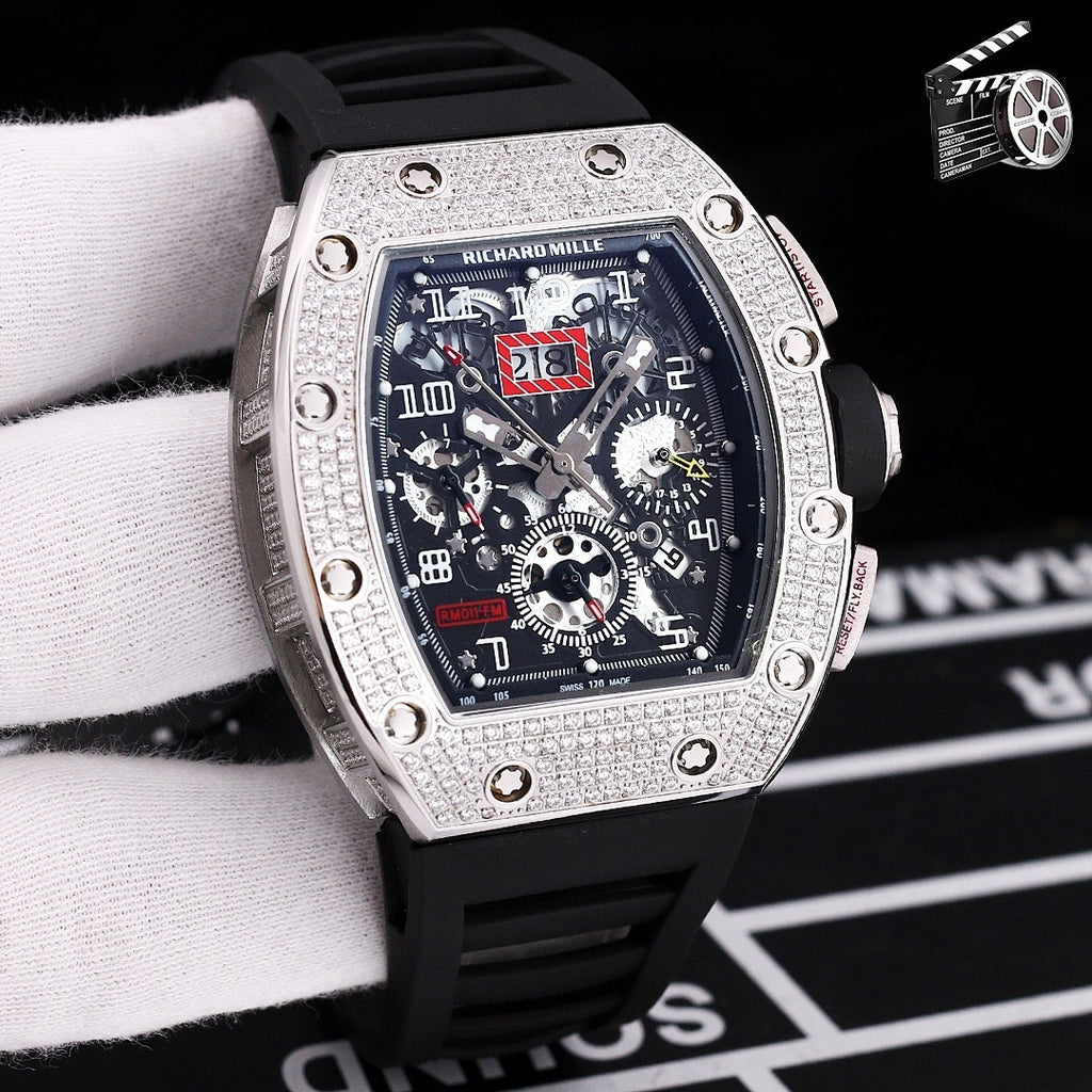 Wristwatch with silver case, black silicone strap, skeleton dial with gear details