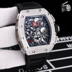 Wristwatch with silver case, black silicone strap, skeleton dial with gear details
