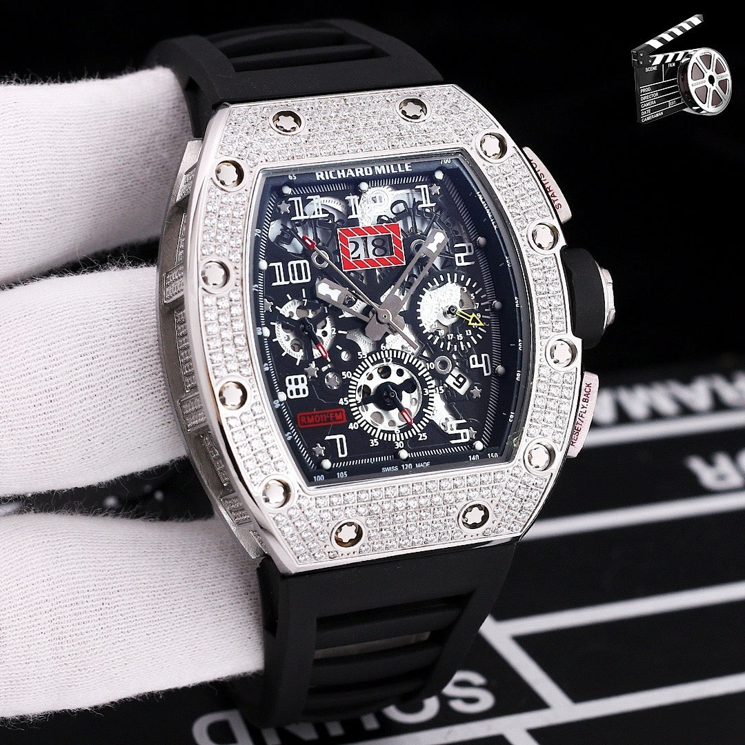 Wristwatch with silver case, black silicone strap, skeleton dial with gear details