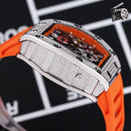 Wristwatch side close-up with orange silicone strap and textured silver case band