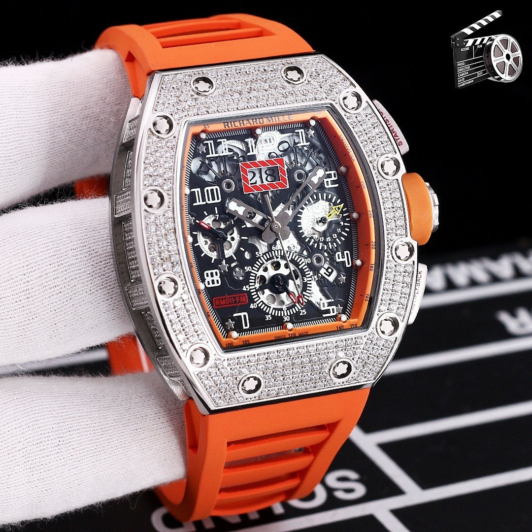 Wristwatch with silver case, orange silicone strap, skeleton dial with colorful details