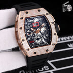 Rose gold diamond bezel wristwatch with black silicone strap and skeleton dial.