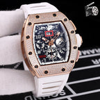 Rose gold diamond bezel wristwatch with white silicone strap and skeleton dial.