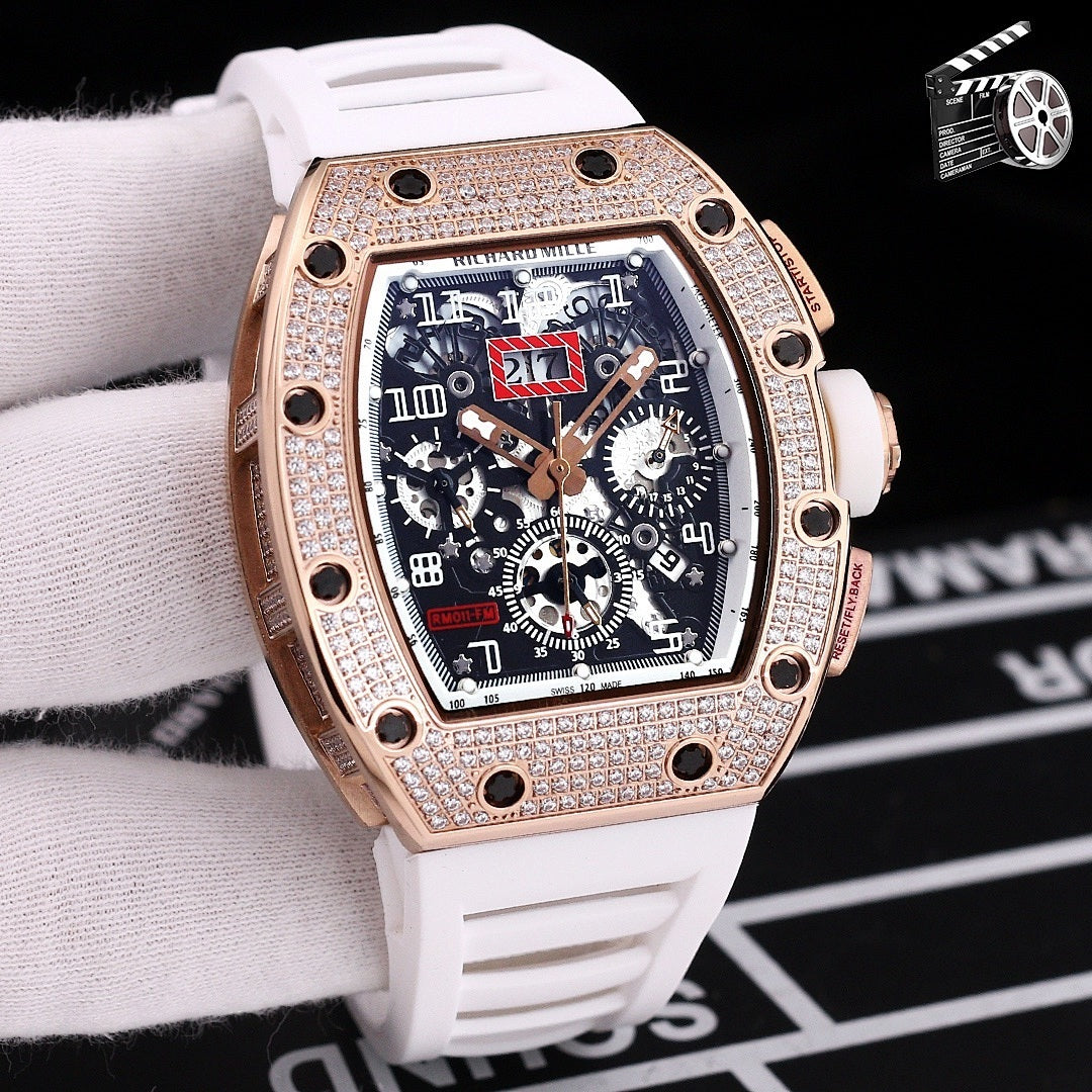 Rose gold diamond bezel wristwatch with white silicone strap and skeleton dial.