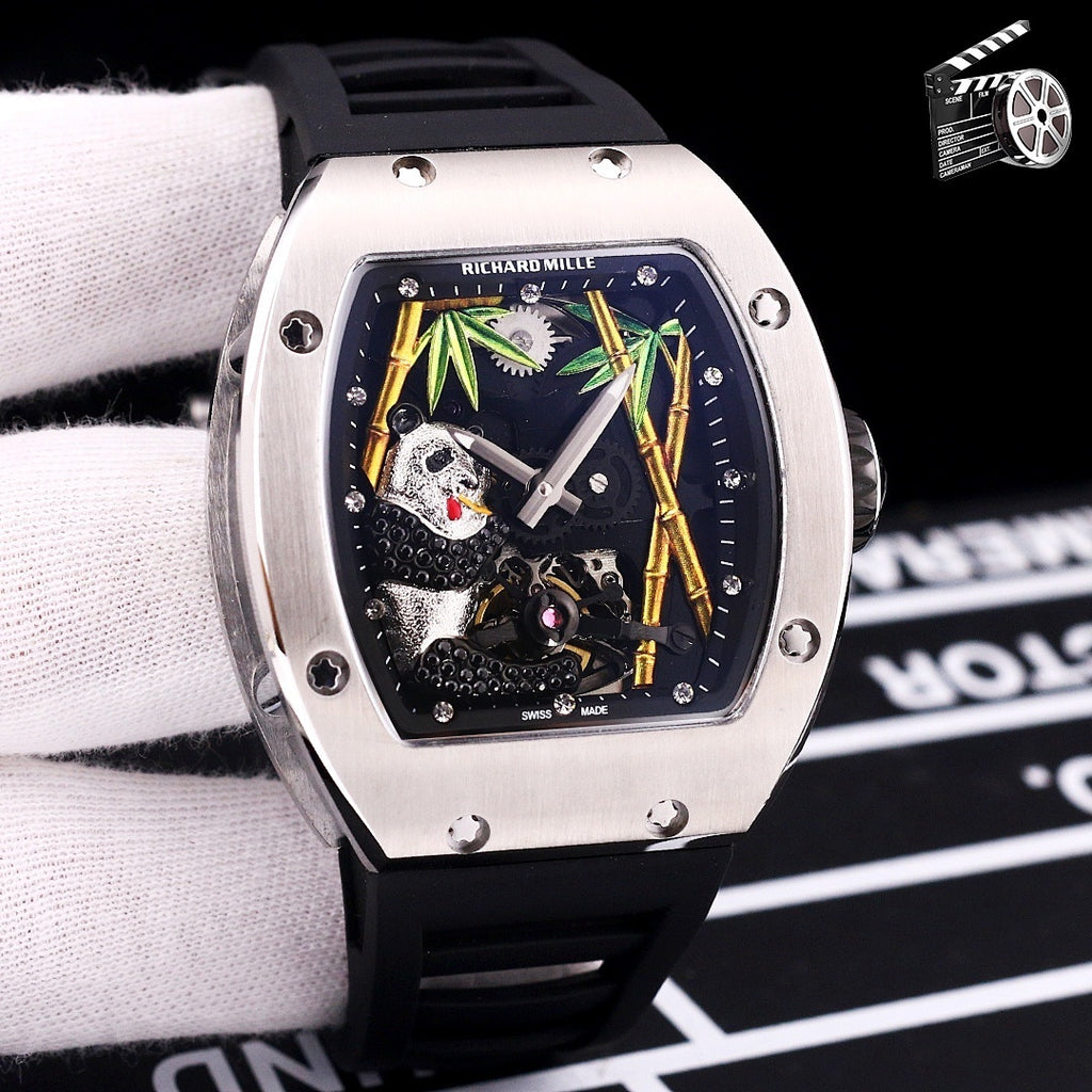 Richard Mille watch with dark rubber strap, stainless case, skeleton dial with green accents.