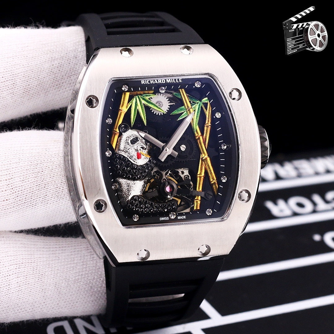 Richard Mille watch with dark rubber strap, stainless case, skeleton dial with green accents.