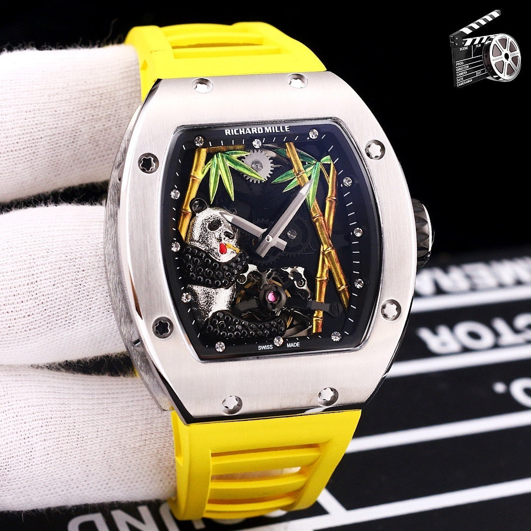 Richard Mille watch with yellow rubber strap, stainless case, skeleton dial with green and gold details.