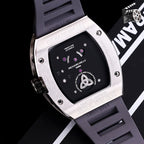 Richard Mille watch with dark case back, visible mechanical details and purple accents.