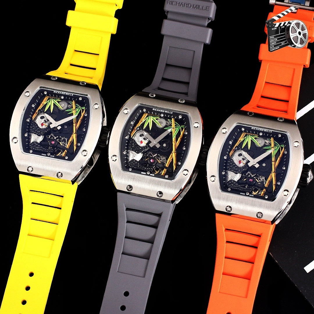 Richard Mille watches on black background with yellow, gray, and orange rubber straps.