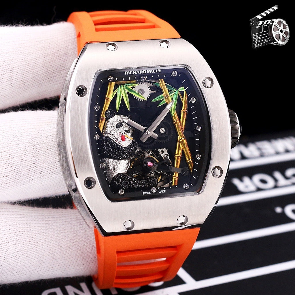 Richard Mille watch with orange rubber strap, stainless case, skeleton dial with green accents.