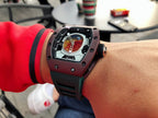 Richard Mille watch with dark blue strap, close-up of square case and skeleton dial