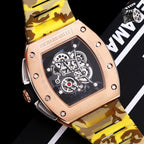 Richard Mille watch with rose-gold case and yellow camouflage strap, angled view.